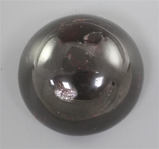 A Chinese red gem stone cabochon shaped scroll weight, diameter 5.1cm